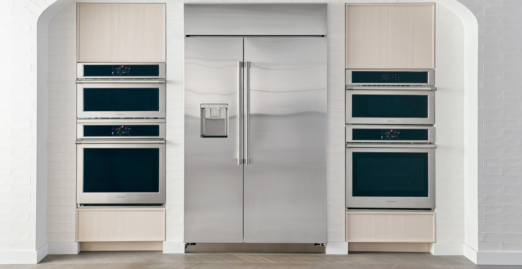 photo of a large, shiny, stainless steel, built-in, french-door refrigerator